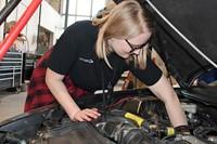 Student working on car